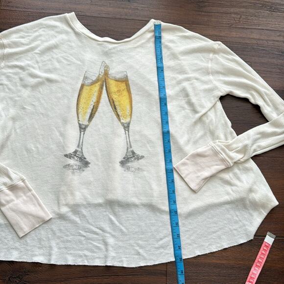 WildFox Pee Loved Long Sleeve Oversized Top with Champagne glasses graphic. - Picture 5 of 6